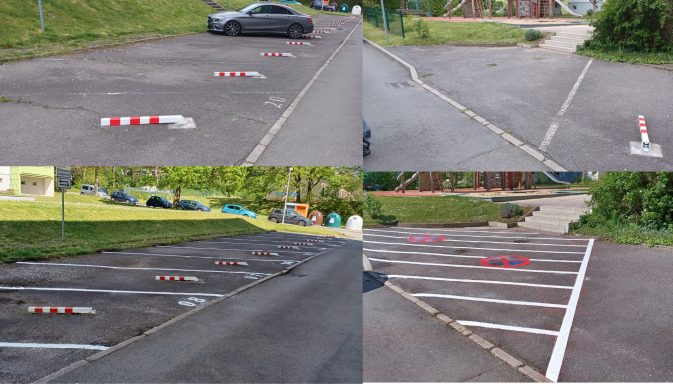 Markierte Parkplätze mit Radstoppern, Stellplatznummern und Sperrflächen mit Halteverbot im Außenbereich.