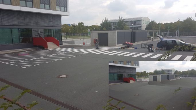 Neu aufgebrachte Bodenmarkierungen mit Zebrastreifen und Feuerwehrstellplatz auf einem Firmengelände